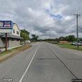 Chemical odor from fire in oil barrel near shop