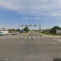 Older man hitchhiking on roadway at Colorado Blvd & Firestone Blvd