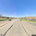 Woman walking on highway shoulder near Riverside