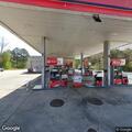 Woman having panic attack with breathing difficulty at gas station