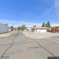 Suspicious person climbing fence behind clinic