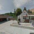 Older male with bleeding wounds crawls across street