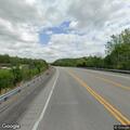 Loose metal on semi-truck trailer creates road hazard