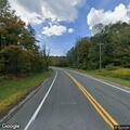 Caller reports erratic driver on US-20