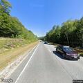 Elderly woman found slumped over wheel on I-93