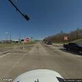 Stopped vehicle at red light, occupants possibly asleep