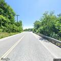 Report of hitchhiker on Minot Ave sidewalk
