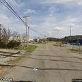 Small fire beside railroad bridge in Karns