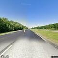 Corvette crashes off I-74 shoulder into fence