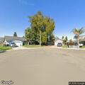 Truck parked on curb blocking oncoming traffic