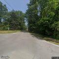 Officer checks on male sitting roadside at Old Nashua Rd