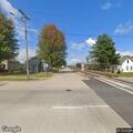 Traffic stop on red pickup near railroad tracks
