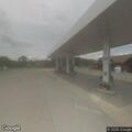 Large gas spill and person unconscious at gas pump