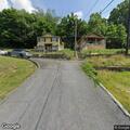 Owner reports concern over damage to vacant house