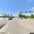 Officer conducts traffic stop on white SUV
