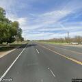 Person dumping trash along Highway 99 roadside
