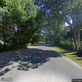 Tree with wires blocking road in Wainscott