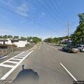 Injury crash with vehicle leaking fluid on Western Ave