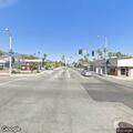 Person experiencing head pain at Pasadena intersection