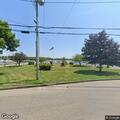 Children jumping into shallow water near old landing