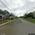 Officer checks road blocked by construction work