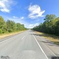 Male driver slumped over console at I-95 rest area