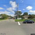 Man sleeping in car with windows up on Belmore Ave