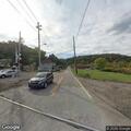 Vehicle crashes from hay field onto roadway