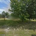 Rubbish and tire fire outside trailer in Belleville