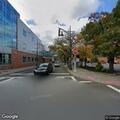 Car crashes into building and traffic light pole