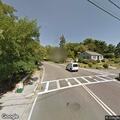 Motorcycle speeding into town from Washington Street