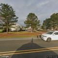 Disabled car causing traffic hazard at apartments