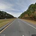 Rock from dump truck damages car windshield