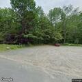 Suspicious vehicle in wildlife marsh parking lot
