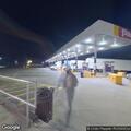 Elderly confused man with car trouble at gas station