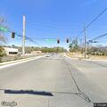 Loose dog chasing cars in roadway