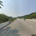 Small SUV leaves I-70 and strikes roadside sign