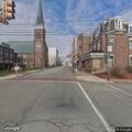 Tractor trailer hits light pole, blocks road