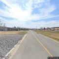 Person lying beside road with bicycle on Pruett Ln