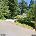 Person standing with chest pain at G Avenue in Lake Oswego