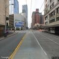 Person panhandling near Olive Way and Stewart Street