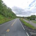 Truck clips mirror of parked car on Schoonmaker