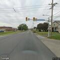 Unconscious man slumped over wheel in black sedan