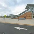 Person with leg pain at Ashburn Metro Station platform
