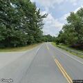 Tree on wires causing low hanging lines on road