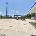 Car hits pole at gas station on Highway 557