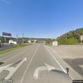 Deputy checks on man sitting in field by highway