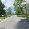 Motorcycle speeding on South Street without helmet