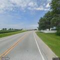 Downed power line and light post near Woodhull