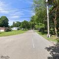 Officer contacts person on lawn mower